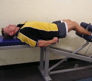Paul Lucchi in the leg extended position of the HipneeFlex hip and knee flexor strength developer